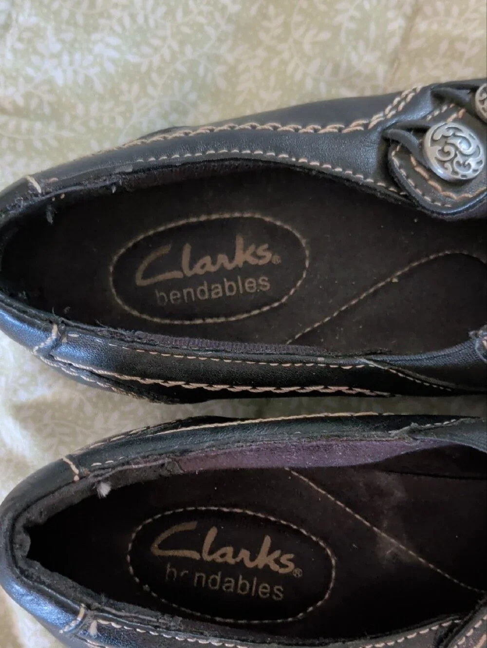 Clarks Black Slip-On Loafers with Silver Button Accent